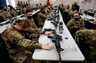  ?? Photos by Jessica Phelps / Staff photograph­er ?? A group of basic trainees at Joint Base San Antonio-Lackland nervously wait for their first chance to fire live rounds.