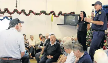  ?? Picture: FREDLIN ADRIAAN ?? BEATING THE BAD GUYS: Bernadette Nel-Naude and operations manager Monty Montgomery from Atlas Security address the residents at the Buffelsfon­tein Retirement Village