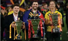  ?? Photograph: Gareth Copley/Getty Images ?? Tom Halliwell, James Tedesco and Kezie Apps show off their trophies.