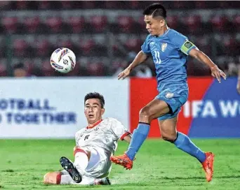  ?? AFP ?? Keen fight: Chhetri and Afghanista­n’s Rahmat Akbari vie for possession.