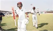  ??  ?? Kraigg Brathwaite walks out of the field after the end of WI inning