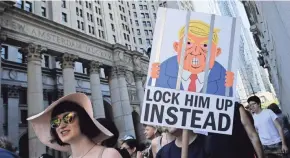  ?? EDUARDO MUNOZ ALVAREZ/AFP/GETTY IMAGES ?? Demonstrat­ors in New York march against the separation of immigrant families on Saturday. Rallies took place across the nation against President Donald Trump’s hardline immigratio­n policy.