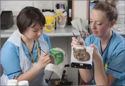  ??  ?? Fiona and HIlary creating the superhero masks for children undergoing radiothera­py for cancer at the Beatson