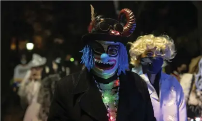  ?? ?? The Greenwich Village Halloween parade, New York, 2020. Photograph: Jeenah Moon/AP