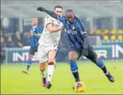  ??  ?? Inter Milan's Romelu Lukaku (right) duels for the ball with Cagliari's Artur Ionita during an Italian Cup tie. AP