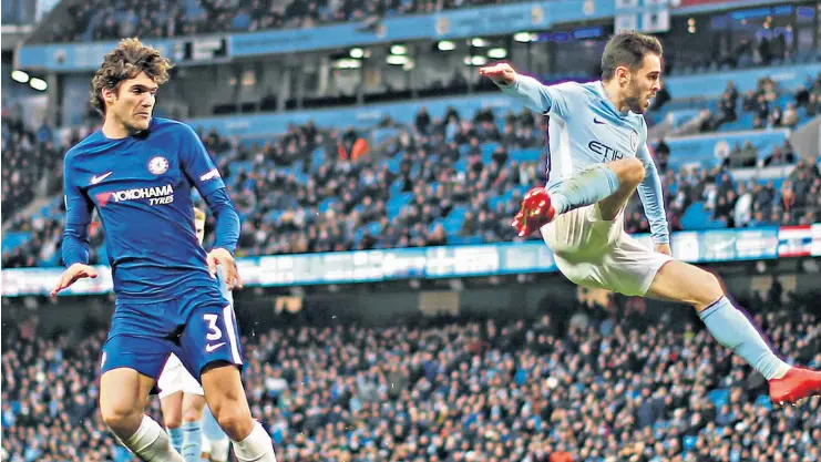  ??  ?? Winning goal: Bernardo Silva fires City ahead against Chelsea