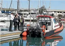  ?? MARTIN DE RUYTER STUFF ?? From left, Nelson city councillor Tim Skinner, deputy harbourmas­ter Amanda Kerr, Nelson Mayor Rachel Reese and councillor Bill Dahlberg check out the new pontoon at the Nelson Marina boat ramp.