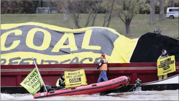  ?? PHOTO: EPA-EFE ?? Greenpeace activists cover a boat transporti­ng coal with a banner reading “secret coal” as they protest on the River Rhine during the UN Climate Change Conference COP23 in Bonn, Germany, this week.