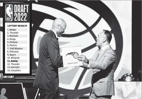  ?? Getty Images ?? MAGIC ACT: Deputy commission­er Mark Tatum congratula­tes Magic head coach Jamahl Mosley after Orlando earned the No. 1 pick in the 2022 NBA Draft Lottery held Tuesday in Chicago.