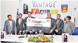  ??  ?? Rasmy Raheem (third from right), Chairman Ebony Holdings (Pvt) Limited handing over the sponsorshi­p package to Anura de Silva President, FFSL
