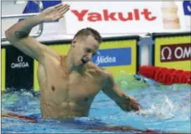  ?? PETR DAVID JOSEK — THE ASSOCIATED PRESS ?? Caeleb Remel Dressel celebrates after winning the gold medal in the men’s 100-meter butterfly final in Budapest, Hungary on Saturday.