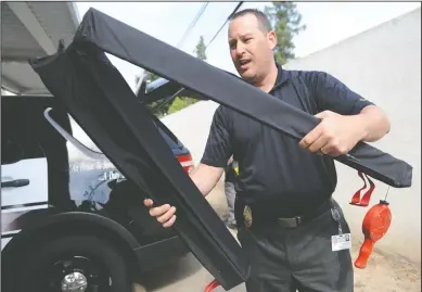  ?? BEA AHBECK/NEWS-SENTINEL ?? Lodi Police Lt. Sierra Brucia talks about the department’s stop strips, which can be deployed during a pursuit, as he discusses the department’s approach to vehicle pursuits, at the Lodi Police Department on Thursday.