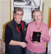  ??  ?? Warragul Camera Club president Ruth Burleigh (left) presents life membership to Gwen Wolfe.