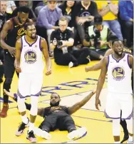  ?? Marcio Jose Sanchez / Associated Press ?? Warriors forward Kevin Durant ( 35) reacts to a call while standing over Cavaliers forward LeBron James during Game 1 of the NBA Finals on Thursday.