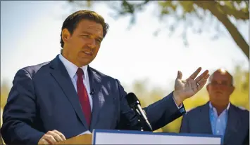  ?? (ALAN YOUNGBLOOD — OCALA STAR-BANNER VIA THE ASSOCIATED PRESS ?? Florida Gov. Ron Desantis speaks at a drive-thru COVID-19 vaccinatio­n site in Ocala, Fla., on Friday.