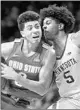  ?? ANDY CLAYTON-KING/AP ?? Marcus Carr defends Ohio State’s D.J. Carton during Minnesota’s upset Sunday.