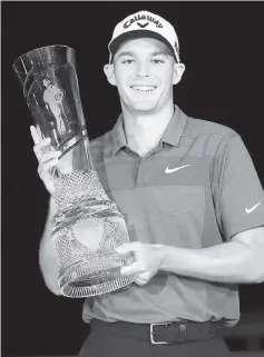  ??  ?? Aaron Wise poses with the trophy after winning the AT&T Byron Nelson at Trinity Forest Golf Club in Dallas,Texas.