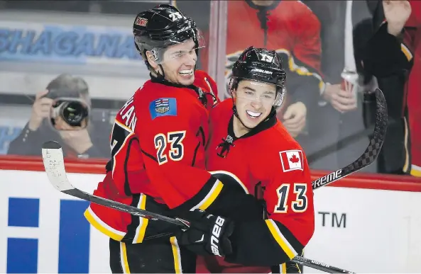  ?? JEFF McINTOSH/THE CANADIAN PRESS FILES ?? Sean Monahan, left, and Johnny Gaudreau help put the Calgary Flames in position to be a contender — if they can shore up their goaltendin­g.