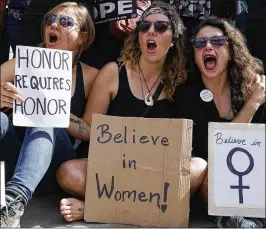  ?? ALEX WONG / GETTY IMAGES ?? Activists shout slogans during a rally in front of the U.S. Supreme Court on Friday in Washington. Organizers staged the rally in a call to drop the nomination of Judge Brett Kavanaugh to the U.S. Supreme Court.