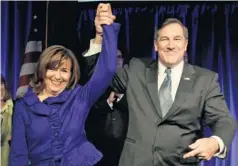  ?? MICHAEL CONROY, AP ?? Sen.-elect Joe Donnelly, D-Ind., with wife Jill, beat RichardMou­rdock, despite groups spending more than $4.7 million to defeat him.