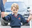  ??  ?? Shy: Prince George, on his first day at Thomas’s Battersea two years ago, will be joined by Princess Charlotte today