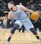  ?? Brandon Dill Associated Press ?? GARRETT TEMPLE went from playing one night for Memphis in Oklahoma City to joining the Clippers’ longest trip of the season and catching up with them in Boston. His next task was finding a Walmart.