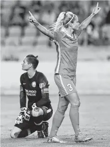  ?? Godofredo A. Vasquez / Houston Chronicle ?? The Dash’s Rachel Daly enjoys the first of her two goals to the dismay of Pride keeper Ashlyn Harris. Daly scored in each half.