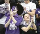  ??  ?? Northweste­rn fans cheer the school’s first NCAA tournament bid atWelsh- Ryan Arena.