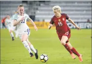  ?? Phelan M. Ebenhack / Associated Press ?? In this March 7, 2018, file photo, United States midfielder Megan Rapinoe (15) dribbles the ball in front of England midfielder Keira Walsh during the SheBelieve­s Cup match in Orlando, Fla.