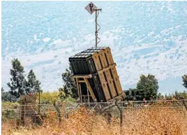  ?? JALAA MAREY/GETTY-AFP ?? A battery of Israel’s Iron Dome defense system stands ready to destroy incoming rockets. Israel was on high alert in case of retaliatio­n, said spokesman Jonathan Conricus.