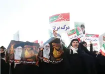  ??  ?? Iranian pro-regime supporters take out a rally in the city of Mashhad on Thursday. (AFP)