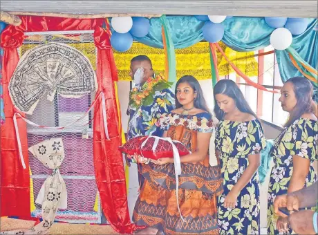  ?? Picture: JONA KONATACI ?? Shopowner Rohit Chand, left, and his family at the opening of his shop at Sautabu Village in Navosa.