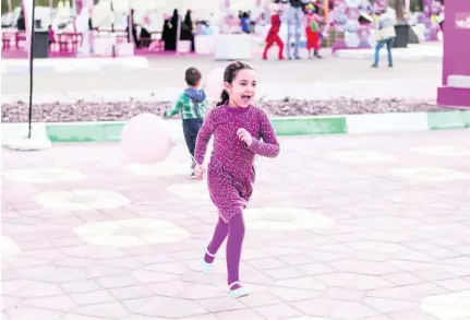  ??  ?? A little girl plays at Zayed Sports City where the closing ceremony of the Pink Caravan Ride 2017 is happening. Reem Mohammed / The National