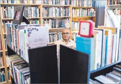  ??  ?? Bookworms: Angelo Fick (above) has a collection of 27 000 books. Sandile Ngidi (below) is compelled to collect books on subjects that intrigue him. . Photos: Delwyn Verasamy &amp; Rogan Ward