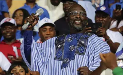  ?? FOTO: THIERRY GOUEGNON, REUTERS/NTB SCANPIX ?? TREDJE GANG: George Weah har to ganger tidligere stilt opp ved valg i Liberia som henholdsvi­s presidentk­andidat og visepresid­entkandida­t. Ved tredje forsøk er han favoritt til å bli ny president.