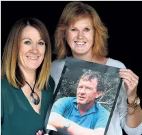  ?? PHOTO: STEPHEN JAQUIERY ?? Proud memory . . . Dunedin sisters Bridget Stedman (left) and Kate Heer hold a photograph of their late father, Brian Heer, who has been identified as the mystery Otago rescuer who helped Wahine’s victims.