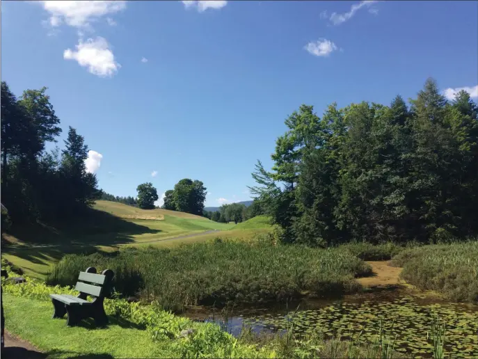  ?? PHOTO BY MOIRA MCCARTHY ?? Natural beauty abounds in Vermont, and scenes like this gentle stream with a bench on which to enjoy the view, have always beckoned visitors.