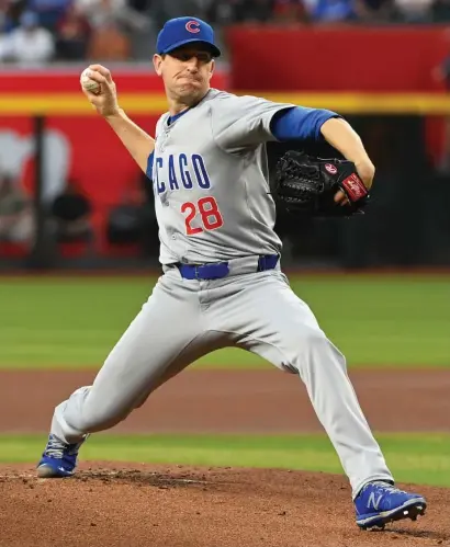  ?? GETTY IMAGES ?? Kyle Hendricks (above) has struggled to start the season, while Ben Brown and Javier Assad have excelled as starters.
