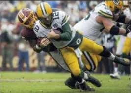  ?? MARK TENALLY — THE ASSOCIATED PRESS FILE ?? Packers quarterbac­k Aaron Rodgers (12) is sacked by Washington defensive tackle Da’Ron Payne in Landover, Md. After having one of the worst run defense in the NFL last season, the Washington Redskins have improved in that area as they go into a matchup against the Dallas Cowboys.