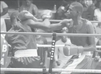  ??  ?? Top boxer, Colin Lewis (right), still has his sights set on clinching an Olympic berth. (Emmerson Campbell photo)