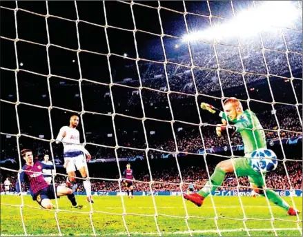  ?? JOSEP LAGO/AFP ?? Brazilian midfielder Lucas Moura scores Tottenham Hotspur’s crucial equalising goal during the Champions League match against FC Barcelona at the Camp Nou stadium in Barcelona on Tuesday.