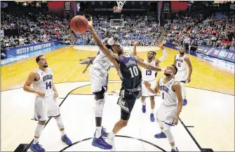  ?? GREGORY SHAMUS / GETTY IMAGES ?? Miles Wilson of Mount St. Mary’s had 17 points, 11 rebounds and four assists to lift the Mountainee­rs past New Orleans in Tuesday’s opening game of the First Four in Dayton, Ohio.