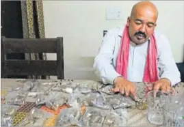  ?? HT PHOTO ?? Imtiaz Alam, resident of Shaheen Bagh, with coins worth `20,000 in New Delhi on Saturday.