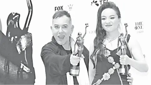  ??  ?? Anthony Wong and Chloe Maayan celebrate their best actor and actress awards.