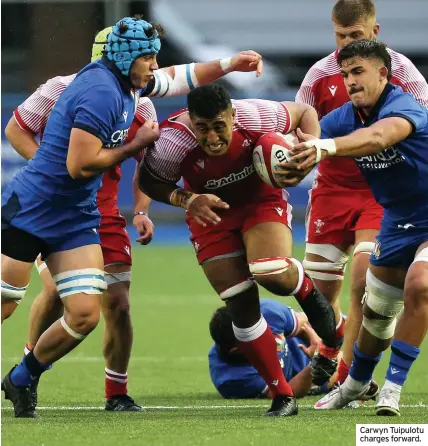  ??  ?? Carwyn Tuipulotu charges forward.