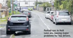  ??  ?? Parked cars in HoltLane are causing major problems for bus drivers.