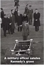  ?? ?? A military officer salutes Kennedy’s grave