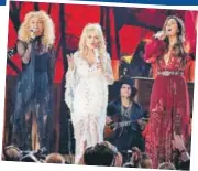  ??  ?? Karen Fairchild, Dolly Parton and Kimberly Schlapman performed at the Grammys as a tribute to the veteran country music singer