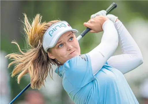  ?? FRANK GUNN THE CANADIAN PRESS ?? Defending champion Brooke Henderson is two shots off the lead at the CP Women's Open in Aurora after playing the last 11 holes at 9 under on Saturday.