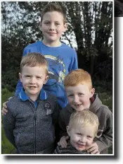  ??  ?? Nathan (11), Leon (7), Bailey (6) and Callum (2) Walsh, who have been left homeless two weeks before Christmas after their logpile caught fire, damaging their house